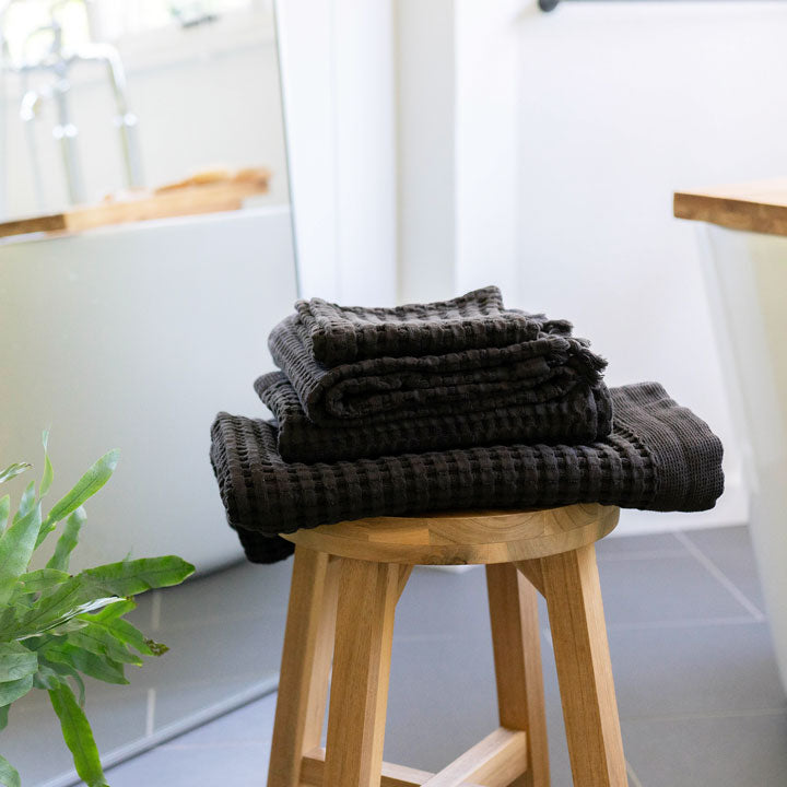 Faded black waffle bath towels add a dramatic touch to your bathroom decor.