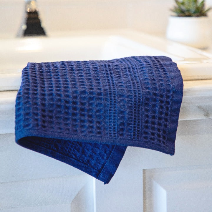 Classic style indigo blue wash cloth looks crisp against white cabinet.