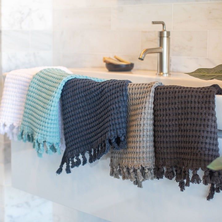 Modern style waffle hand towels with new fun, chic tassels in a variety of colors