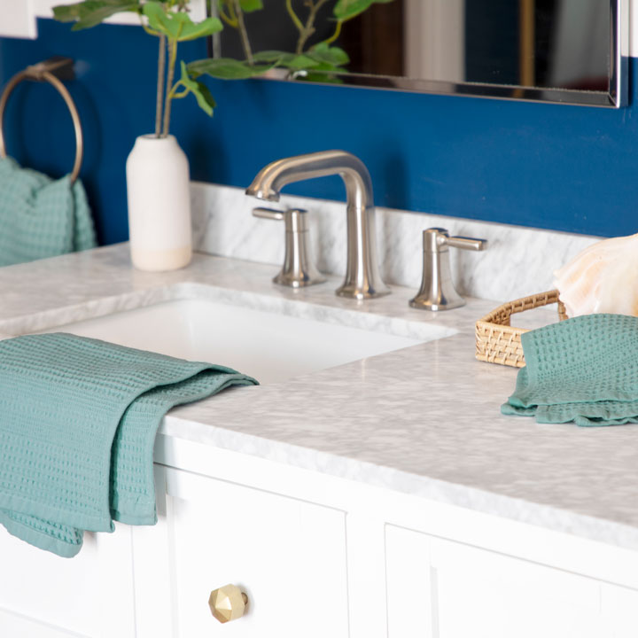 Beachy seafoam waffle towels in blue bathroom