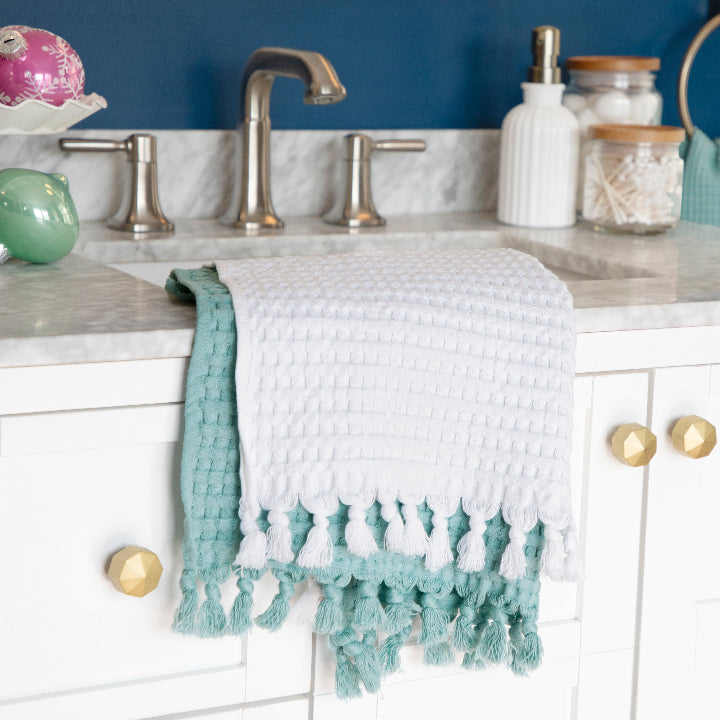 Modern Waffle Tassel Hand Towels layered white and seafoam.