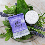 Gilded Tree Relax Deeply shower steamers with lavender and rosemary on a marble surface