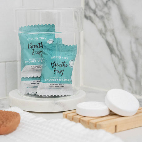 Breathe Easy Eucalyptus Mint Shower Steamers displayed in pretty glass jar on your bathroom counter.