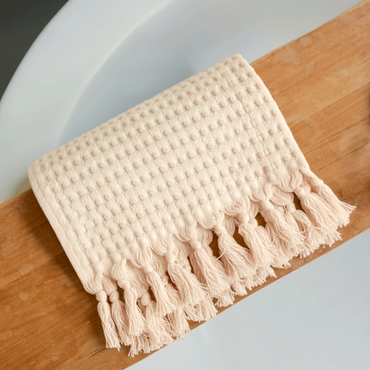 Deep honeycomb squares plus tassels add fun texture to your bathroom