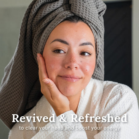 Woman feeling revived and refreshed after using Morning Mint shower steamers.