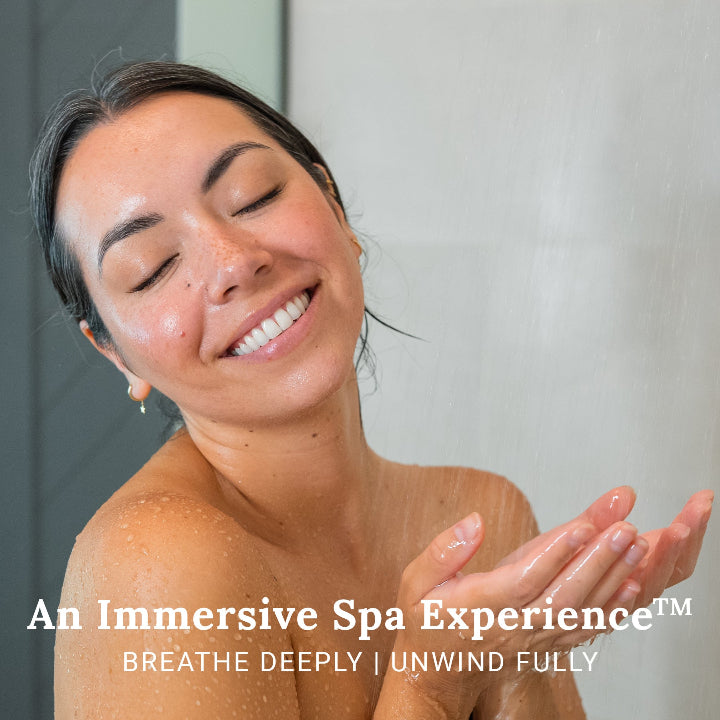 Woman breathing deep and unwinding in shower using Relax Deeply shower steamers.