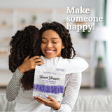 Young girl hugging her mom after gifting her a Relax Deeply shower steamer gift bag.