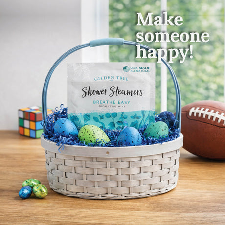 Basket with shower steamers and Easter eggs on a table, with text 'Make someone happy!'.