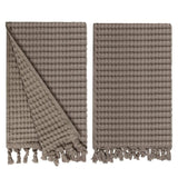 Gilden Tree waffle hand towels for bathrooms with new decorative tassels shows a folded towel.