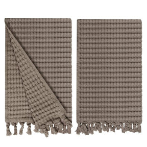 Gilden Tree waffle hand towels for bathrooms with new decorative tassels shows a folded towel.