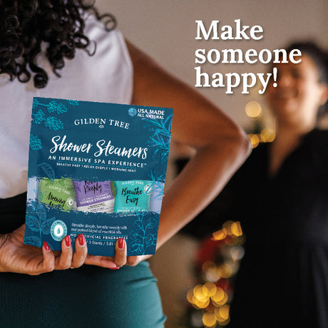 Woman holding a Variety Pack shower steamer gift bag giving it to a dear friend. 