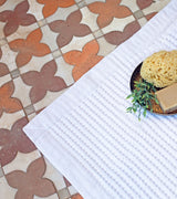 White waffle bath mat is cushy and absorbent.