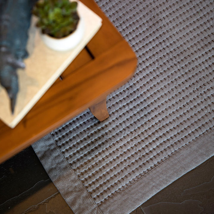 Waffle bath mat is cushy and absorbent.