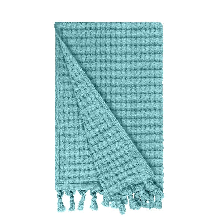 Gilden Tree waffle hand towels for bathrooms with new decorative tassels shows a folded towel.