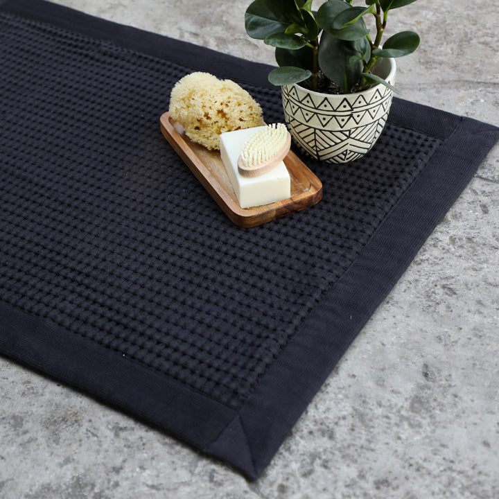 Beautiful Faded Black waffle bathmat for ultimate comfort right out of the shower or bath.