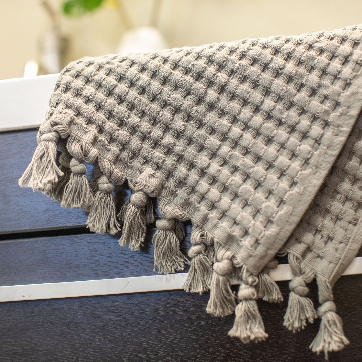 Deep honeycomb squares plus tassels add fun texture to your bathroom