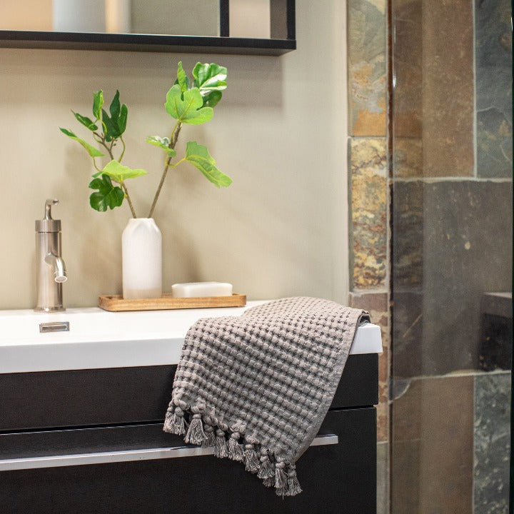 Stone waffle tassel hand towel brings earthy, natural elements to your bathroom