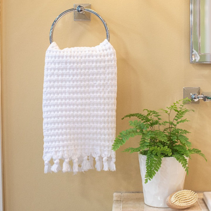 Bright white waffle tassel hand towel is timeless
